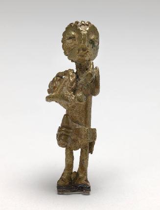 Gold weight in the form of a warrior carrying guns