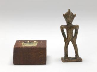 Gold weight in the form of a standing figure