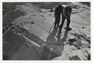 Vince and pit helper barring a stone