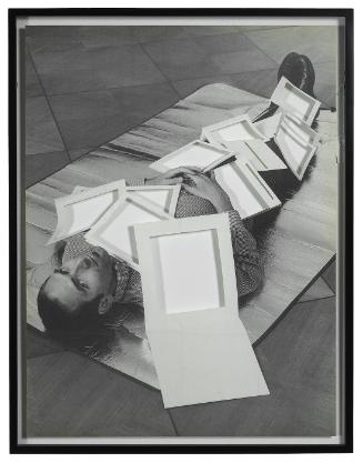 The artist covered in a selection of his Sol LeWitt books (cut) (after Ed Ruscha)
